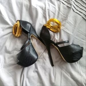 Black and gold platform heels